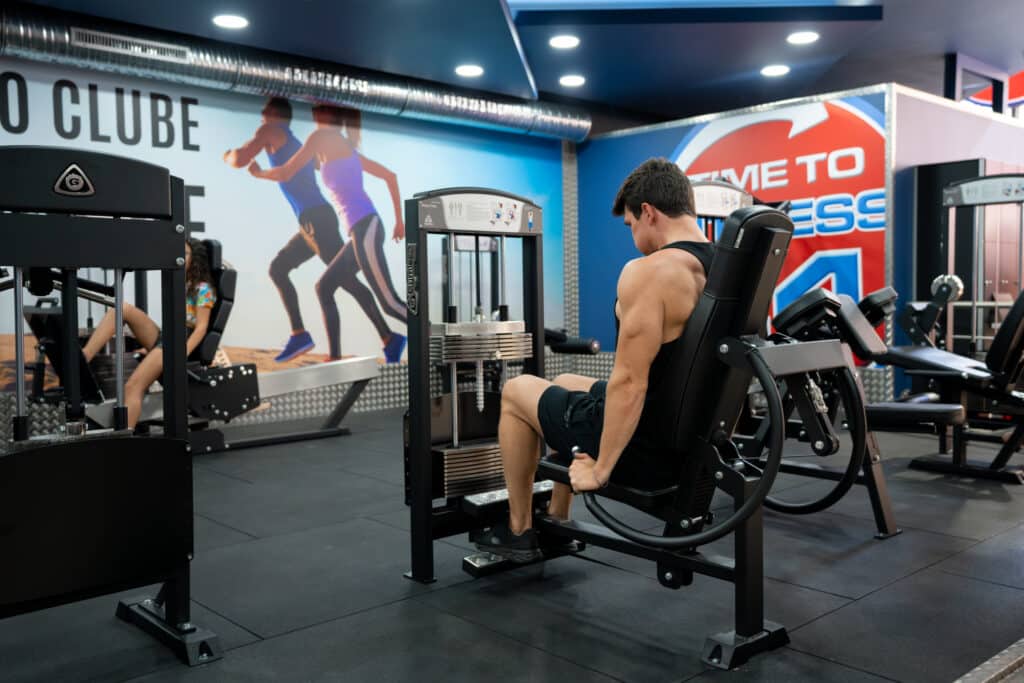 Man working out on Gymlecos Triceps Gym machine in a gym